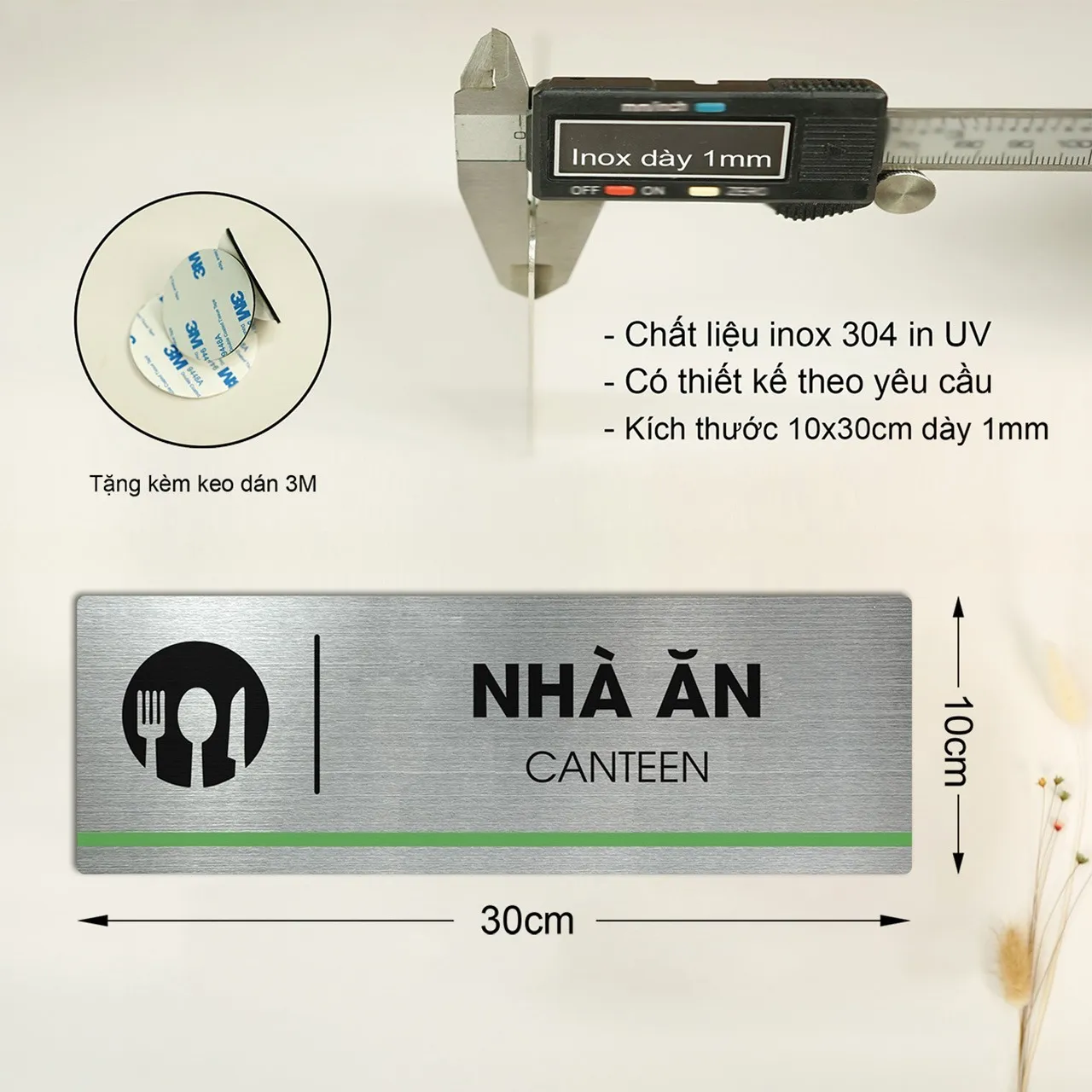 Thông số kỹ thuật bảng tên nhà ăn canteen inox 304 – 10x30cm dày 1mm, kèm keo 3M Thông số thực tế bảng tên nhà ăn canteen inox 304: kích thước 10x30cm, dày 1mm đo bằng thước kẹp, kèm keo dán 3M