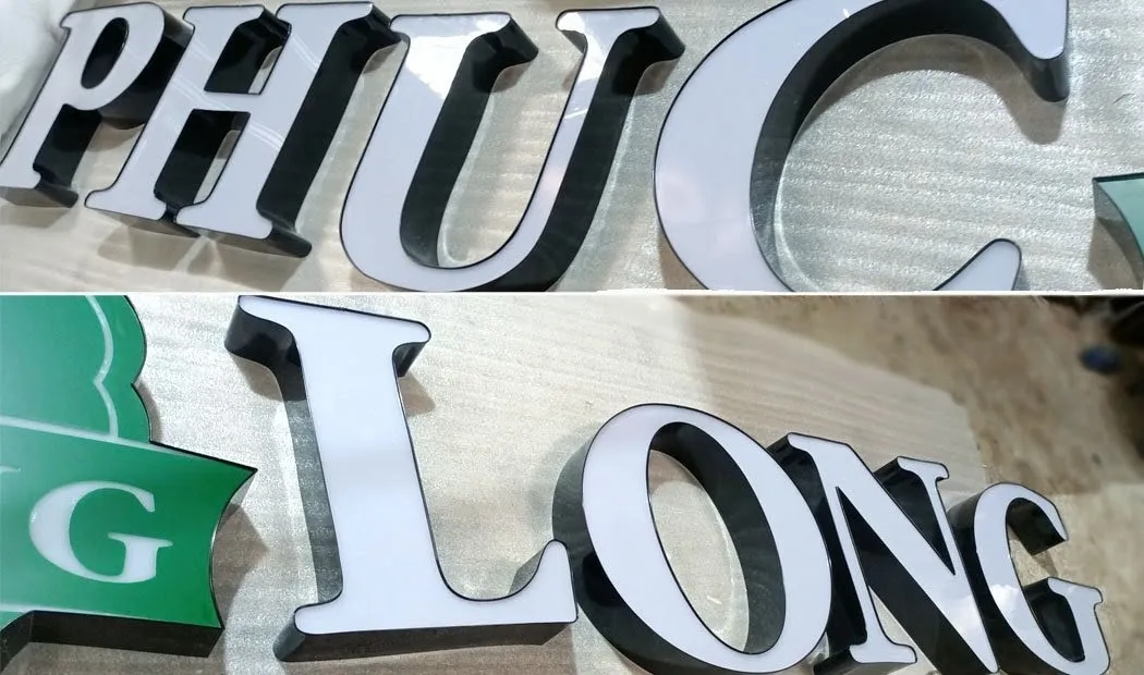 Cận cảnh chữ PHUC Long thể hiện rõ hông inox sơn tĩnh điện màu đen với mặt mica trắng